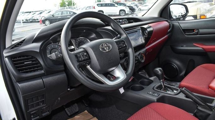 New Toyota Hilux VIII Facelift, 2.7 l, 2024 in Dubai by Najem Motors, White color. GCC Specs | AUTO.AE