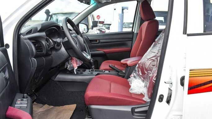 New Toyota Hilux VIII Facelift, 2.7 l, 2024 in Dubai by Najem Motors, White color. GCC Specs | AUTO.AE