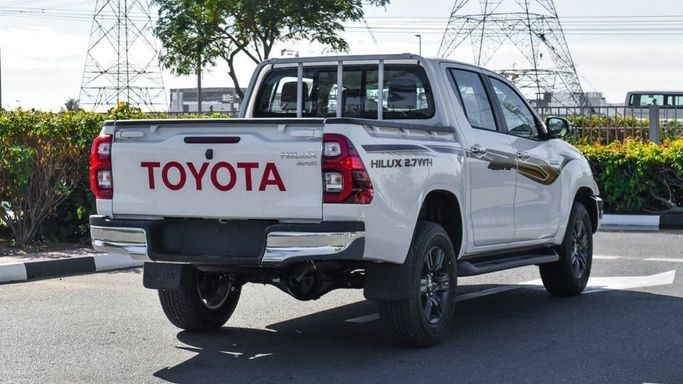 New Toyota Hilux VIII Facelift 2, 2.7 l, 2024 in Dubai by Najem Motors, White color. GCC Specs | AUTO.AE
