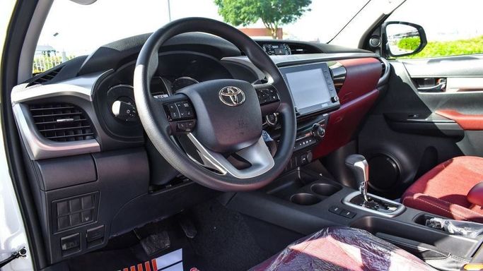New Toyota Hilux VIII Facelift 2, 2.7 l, 2024 in Dubai by Najem Motors, White color. GCC Specs | AUTO.AE