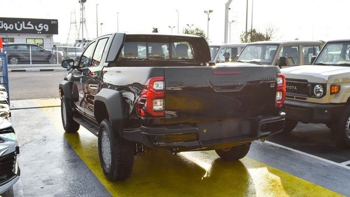 New Toyota Hilux VIII Facelift, 4.0 l, 2024 in Dubai by Najem Motors, Black color. GCC Specs | AUTO.AE
