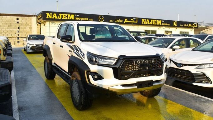 New Toyota Hilux VIII Facelift 2, 2.7 l, 2024 in Dubai by Najem Motors, White color. GCC Specs | AUTO.AE