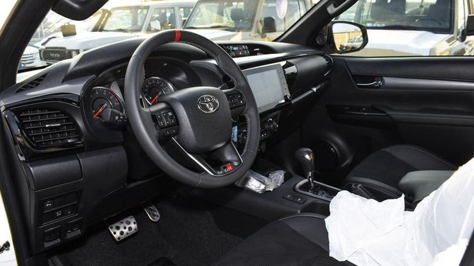 New Toyota Hilux VIII Facelift 2, 2.7 l, 2024 in Dubai by Najem Motors, White color. GCC Specs | AUTO.AE