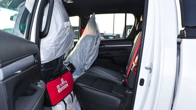 New Toyota Hilux VIII Facelift 2, 2.7 l, 2024 in Dubai by Najem Motors, White color. GCC Specs | AUTO.AE
