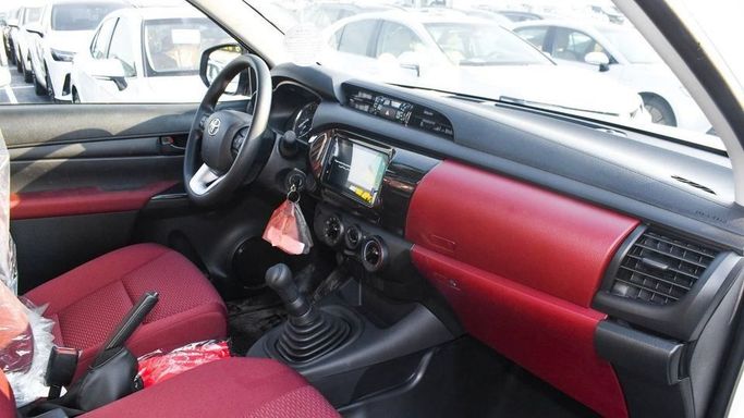 New Toyota Hilux Extra Cab VIII Facelift, 2.4 l, 2024 in Dubai by Najem Motors, White color. GCC Specs | AUTO.AE