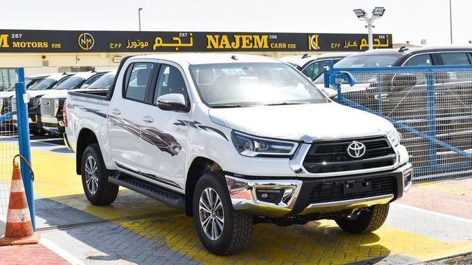 New Toyota Hilux VIII Facelift, 2.7 l, 2023 in Dubai by Najem Motors, White color. GCC Specs | AUTO.AE