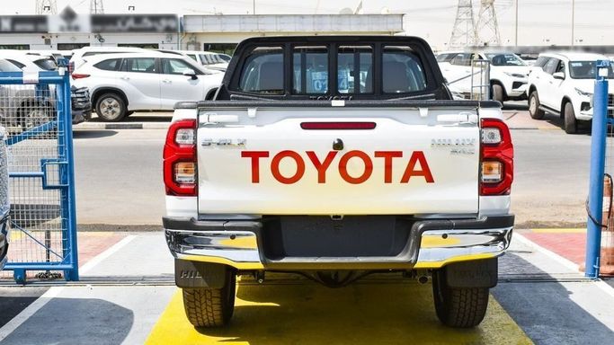 New Toyota Hilux VIII Facelift, 2.7 l, 2023 in Dubai by Najem Motors, White color. GCC Specs | AUTO.AE