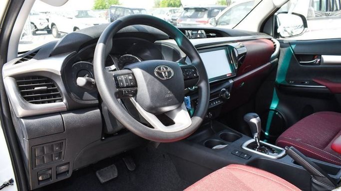 New Toyota Hilux VIII Facelift, 2.7 l, 2023 in Dubai by Najem Motors, White color. GCC Specs | AUTO.AE