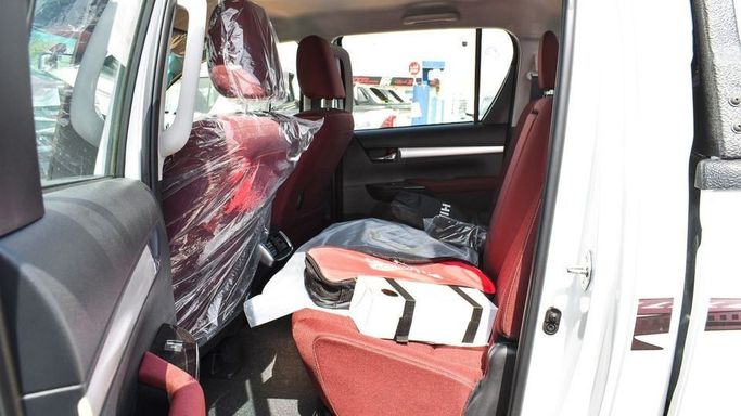 New Toyota Hilux VIII Facelift, 2.7 l, 2023 in Dubai by Najem Motors, White color. GCC Specs | AUTO.AE
