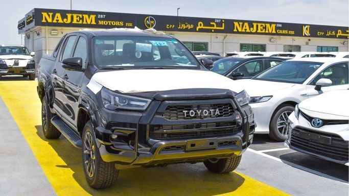 New Toyota Hilux VIII Facelift, 2.8 l, 2023 in Dubai by Najem Motors, Black color. GCC Specs | AUTO.AE