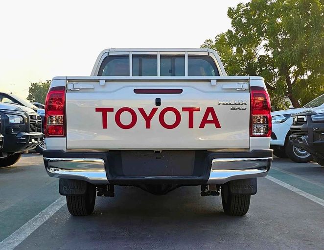 New Toyota Hilux VIII Facelift 2, 2.7 l, 2024 in Dubai by SK Motors, White color. GCC Specs | AUTO.AE