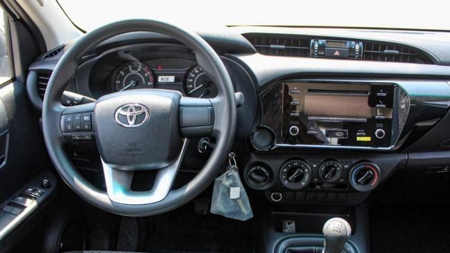 New Toyota Hilux VIII Facelift, 2.4 l, 2023 in Dubai by Falcons GT Motors FZCO, White color. GCC Specs | AUTO.AE