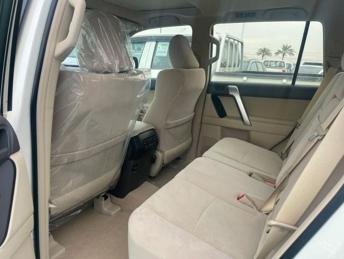 New Toyota Land Cruiser Prado 150 Series Facelift 3, 2.7 l, 2023 in Dubai by Mohamed Hakim Motors, White color. GCC Specs | AUTO.AE