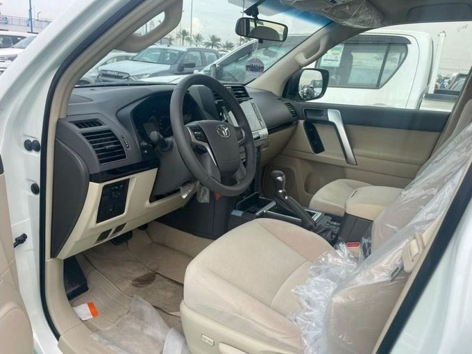 New Toyota Land Cruiser Prado 150 Series Facelift 3, 2.7 l, 2023 in Dubai by Mohamed Hakim Motors, White color. GCC Specs | AUTO.AE