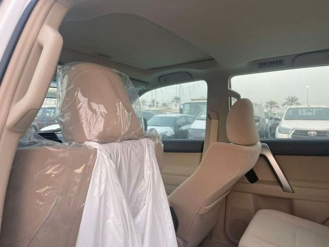 New Toyota Land Cruiser Prado 150 Series Facelift 3, 2.7 l, 2023 in Dubai by Mohamed Hakim Motors, White color. GCC Specs | AUTO.AE