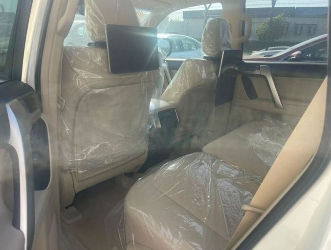 New Toyota Land Cruiser Prado 150 Series Facelift 3, 2.8 l, 2023 in Dubai by Mohamed Hakim Motors, White color. GCC Specs | AUTO.AE