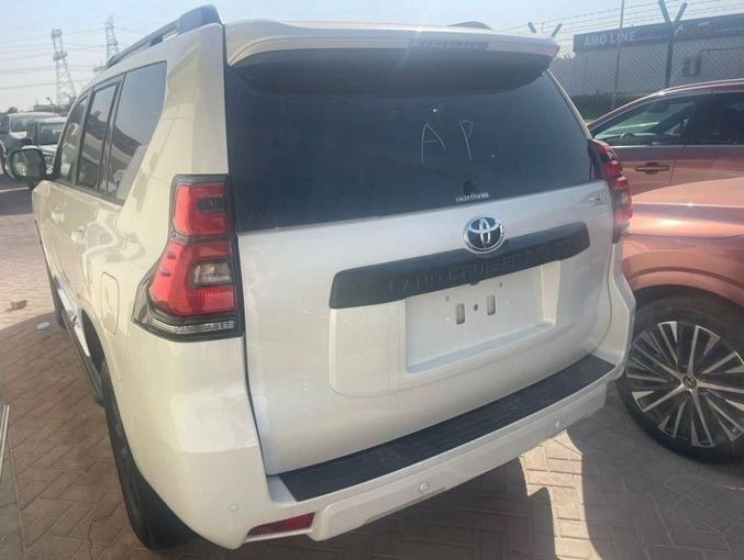 New Toyota Land Cruiser Prado 150 Series Facelift 3, 2.8 l, 2023 in Dubai by Mohamed Hakim Motors, White color. GCC Specs | AUTO.AE