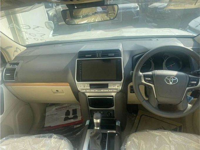 New Toyota Land Cruiser Prado 150 Series Facelift 3, 2.8 l, 2023 in Dubai by Mohamed Hakim Motors, White color. GCC Specs | AUTO.AE