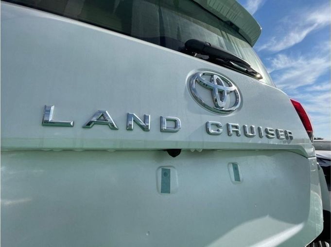 New Toyota Land Cruiser 300 Series, 4.0 l, 2023 in Dubai by Mohamed Hakim Motors, White color. GCC Specs | AUTO.AE