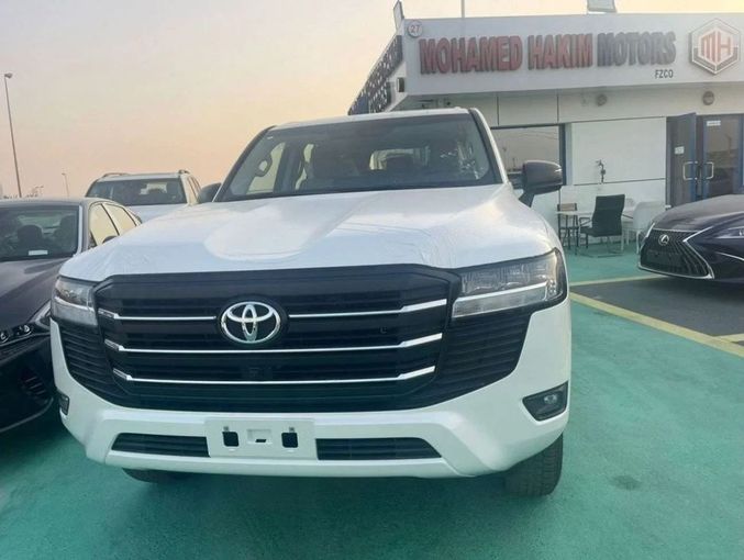 New Toyota Land Cruiser 300 Series, 4.0 l, 2023 in Dubai by Mohamed Hakim Motors, White color. GCC Specs | AUTO.AE