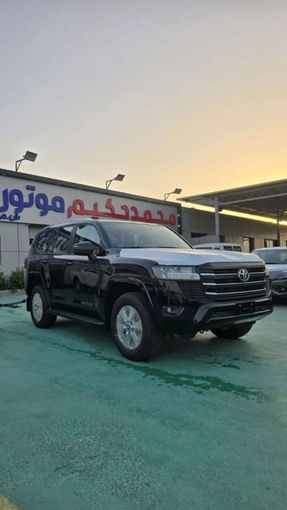 New Toyota Land Cruiser 300 Series, 4.0 l, 2024 in Dubai by Mohamed Hakim Motors, Black color. GCC Specs | AUTO.AE