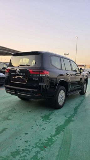 New Toyota Land Cruiser 300 Series, 4.0 l, 2024 in Dubai by Mohamed Hakim Motors, Black color. GCC Specs | AUTO.AE