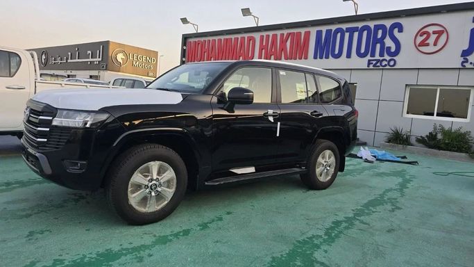 New Toyota Land Cruiser 300 Series, 4.0 l, 2024 in Dubai by Mohamed Hakim Motors, Black color. GCC Specs | AUTO.AE