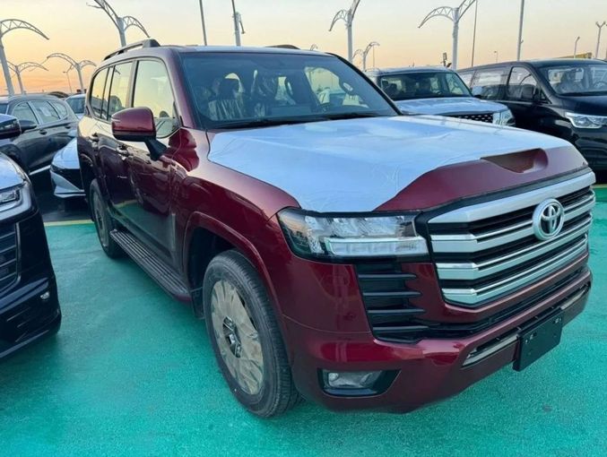 New Toyota Land Cruiser 300 Series, 3.4 l, 2023 in Dubai by Mohamed Hakim Motors, Red color. GCC Specs | AUTO.AE