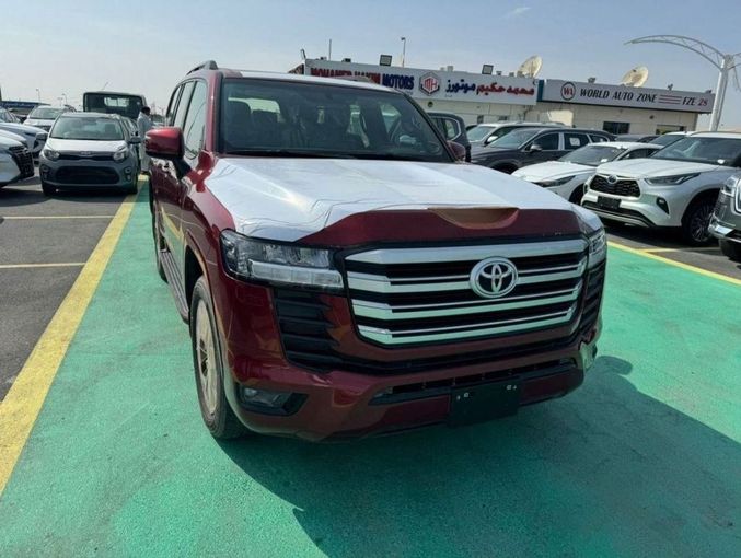 New Toyota Land Cruiser 300 Series, 3.3 l, 2023 in Dubai by Mohamed Hakim Motors, Red color. GCC Specs | AUTO.AE