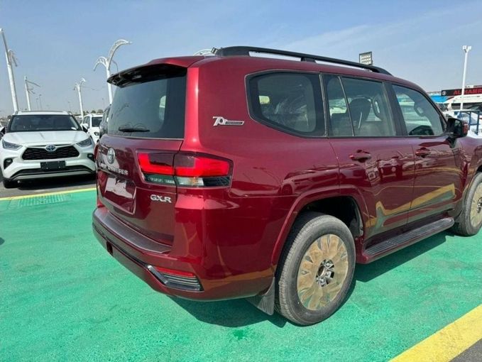 New Toyota Land Cruiser 300 Series, 3.3 l, 2023 in Dubai by Mohamed Hakim Motors, Red color. GCC Specs | AUTO.AE