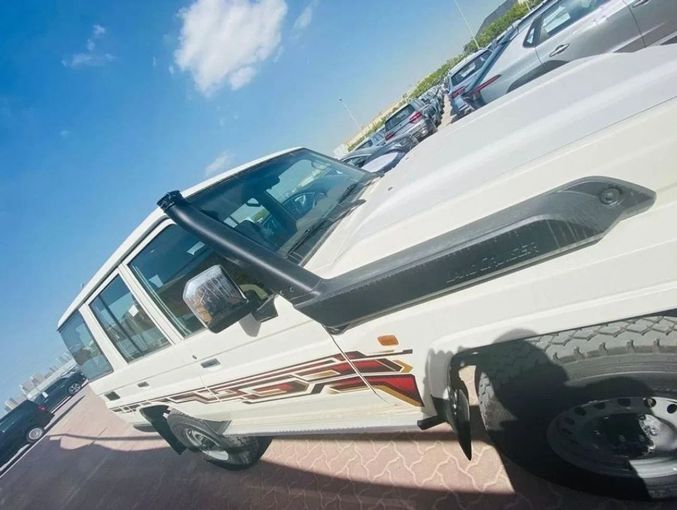 New Toyota Land Cruiser 70 Series Facelift 2, 4.5 l, 2024 in Dubai by Mohamed Hakim Motors, White color. GCC Specs | AUTO.AE
