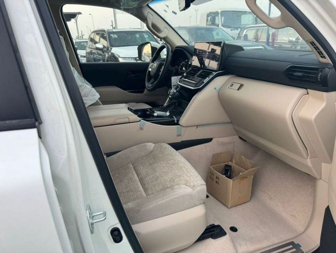 New Toyota Land Cruiser 300 Series, 3.3 l, 2023 in Dubai by Mohamed Hakim Motors, White color. GCC Specs | AUTO.AE
