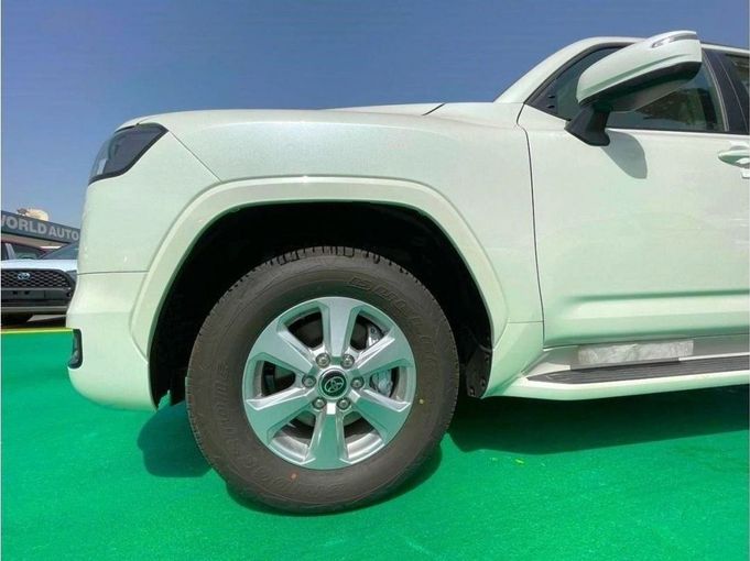 New Toyota Land Cruiser 300 Series, 3.3 l, 2023 in Dubai by Mohamed Hakim Motors, White color. GCC Specs | AUTO.AE