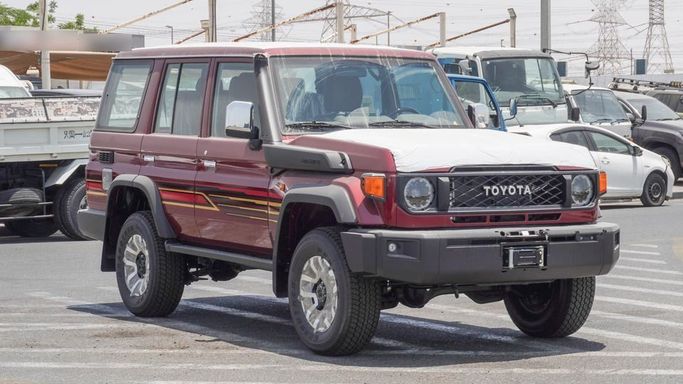 New Toyota Land Cruiser 70 Series Facelift 2, 4.0 l, 2025 in Dubai by Najem Motors, Red color. GCC Specs | AUTO.AE