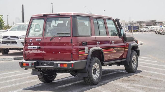 New Toyota Land Cruiser 70 Series Facelift 2, 4.0 l, 2025 in Dubai by Najem Motors, Red color. GCC Specs | AUTO.AE