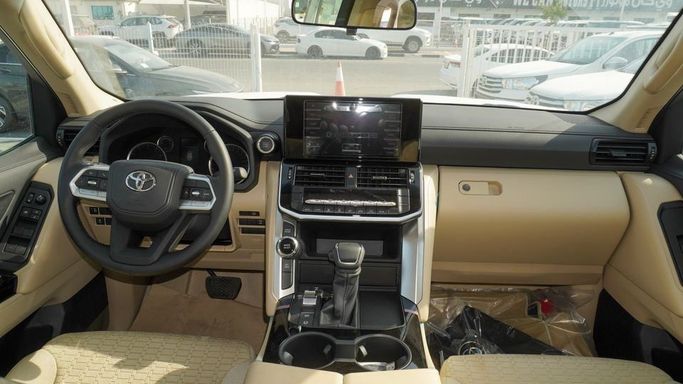New Toyota Land Cruiser 300 Series, 3.4 l, 2024 in Dubai by Najem Motors, White color. GCC Specs | AUTO.AE