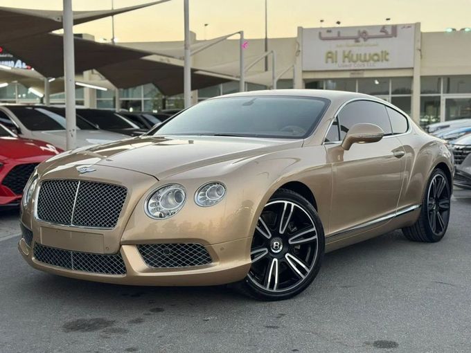 Подержанный Bentley Continental GT II, 4.0 л, 2013 в Шардже от Nour Alnukhba Motors Золотистый цвет. GCC | AUTO.AE