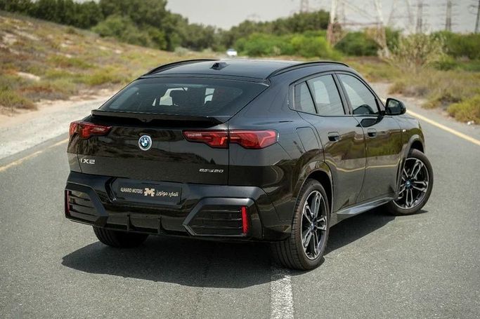 Подержанный BMW iX2, 2024 в Шардже от Almarid Motors Черный цвет. GCC | AUTO.AE