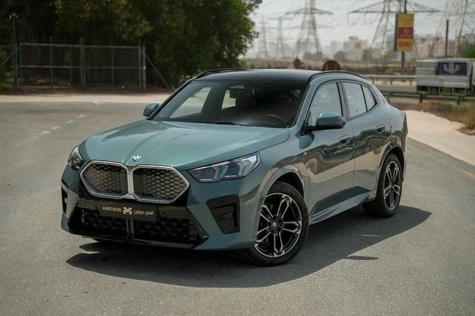 Used BMW iX2 eDrive20, 2024 in Sharjah by Almarid Motors, Green color. GCC Specs | AUTO.AE