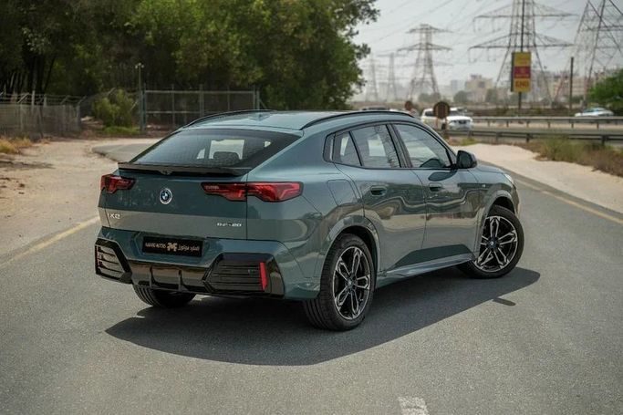 Used BMW iX2 eDrive20, 2024 in Sharjah by Almarid Motors, Green color. GCC Specs | AUTO.AE