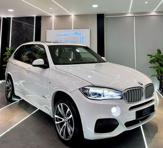 Used BMW X5 50i III (F15), 4.4 l, 2015 in Sharjah by Ayoon Alhoot Motors, White color. GCC Specs | AUTO.AE