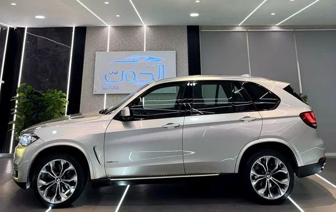 Used BMW X5 50i III (F15), 4.4 l, 2017 in Sharjah by Ayoon Alhoot Motors, Golden color. GCC Specs | AUTO.AE