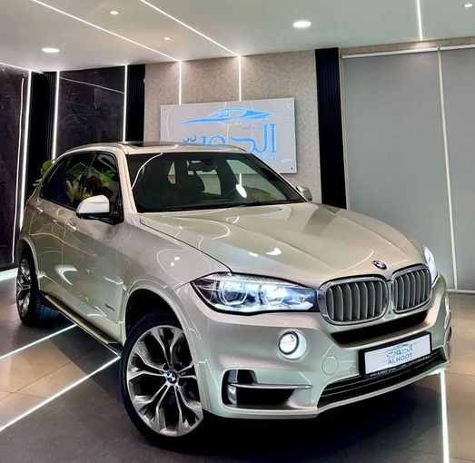Used BMW X5 50i III (F15), 4.4 l, 2017 in Sharjah by Ayoon Alhoot Motors, Golden color. GCC Specs | AUTO.AE