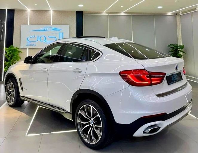 Used BMW X6 50i II (F16), 4.4 l, 2016 in Sharjah by Ayoon Alhoot Motors, White color. GCC Specs | AUTO.AE