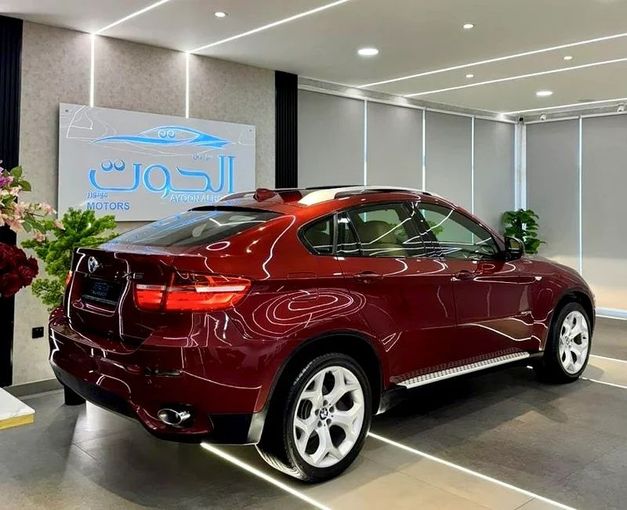 Подержанный BMW X6 35i I (E71), 3.0 л, 2011 в Шардже от Ayoon Alhoot Motors Красный цвет. GCC | AUTO.AE