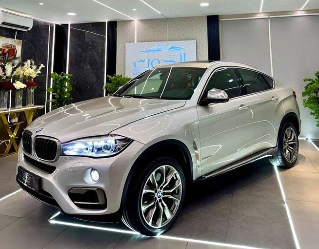 Used BMW X6 50i II (F16), 4.4 l, 2016 in Sharjah by Ayoon Alhoot Motors, Golden color. GCC Specs | AUTO.AE