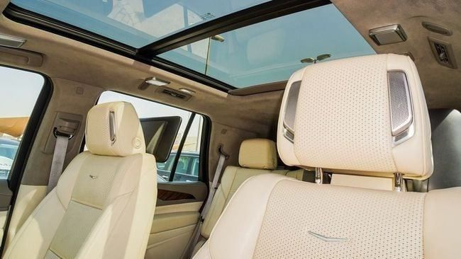 Used Cadillac Escalade V, 6.2 l, 2021 in Sharjah by Alnujoom Al Malakiah Used Cars, White color. GCC Specs | AUTO.AE