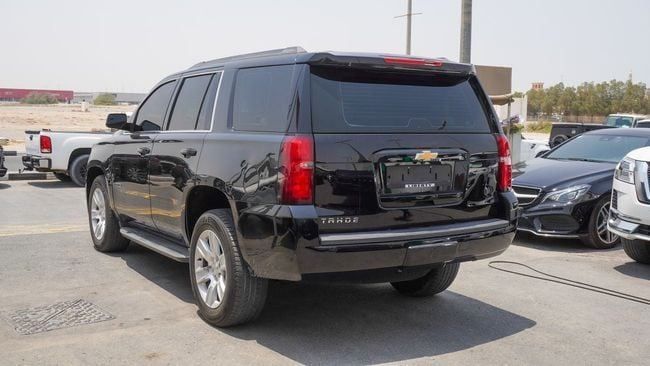 Подержанный Chevrolet Tahoe IV, 6.2 л, 2018 в Шардже от Alnujoom Al Malakiah Used Cars Черный цвет. GCC | AUTO.AE