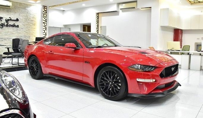 Used Ford Mustang VI Facelift, 5.0 l, 2020 in Sharjah by Honey Gidosha Used Cars Tr., Red color.  | AUTO.AE