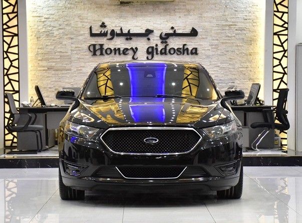 Подержанный Ford Taurus VI Рестайлинг, 3.5 л, 2014 в Шардже от Honey Gidosha Used Cars Tr. Черный цвет.  | AUTO.AE